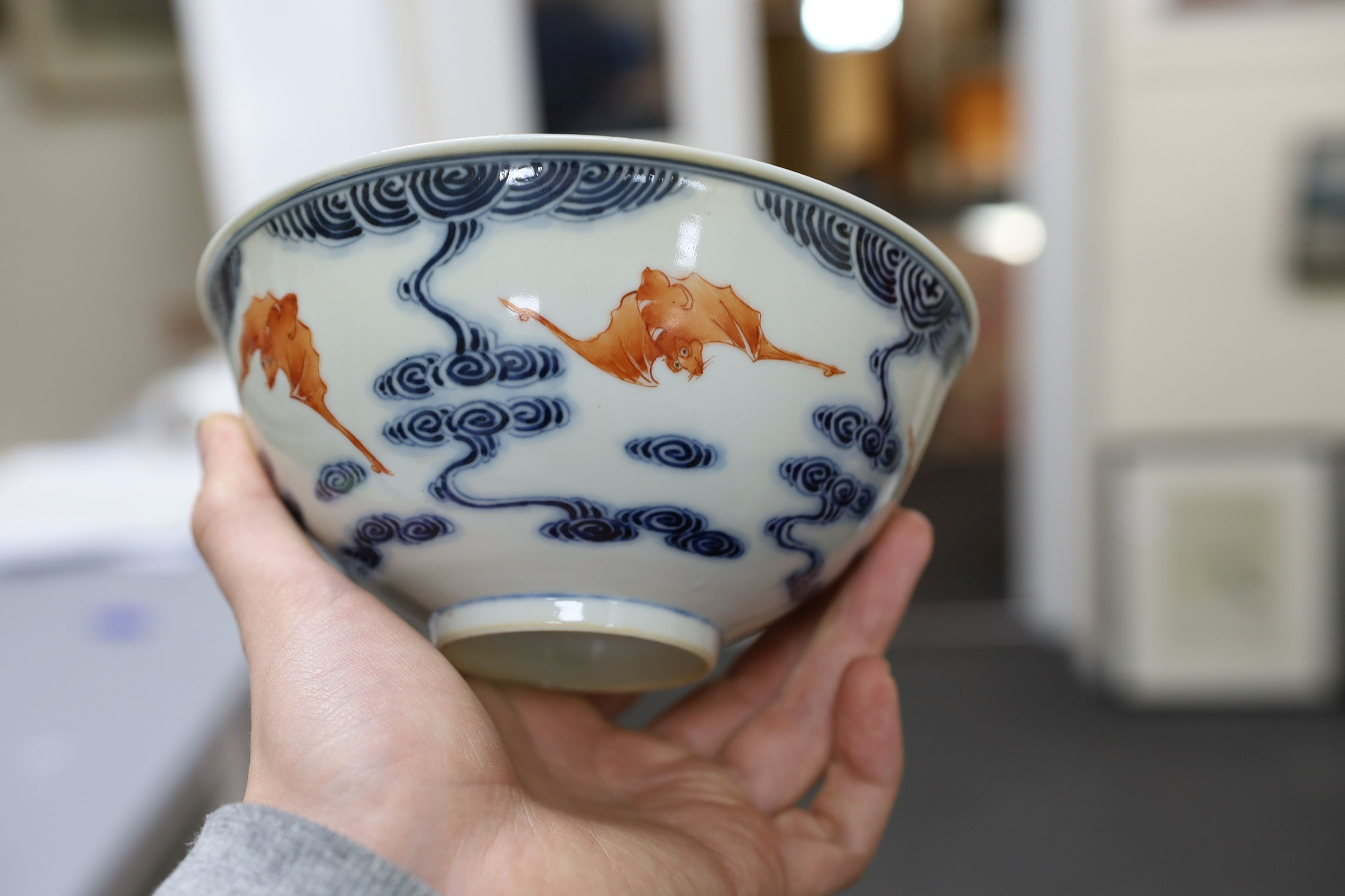 A pair of Chinese iron red and underglaze blue ‘five bat’ bowls, Guangxu mark and probably of the period (1875-1908), 16.5cm diameter
